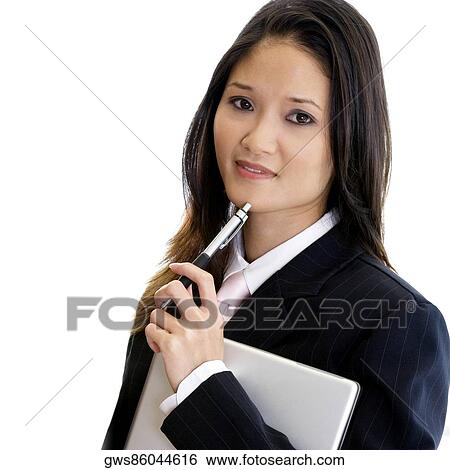 Portrait of a businesswoman holding a pen and a laptop View Large Photo Image Stock Photograph - Portrait of a businesswoman holding a pen and a laptop. Fotosearch