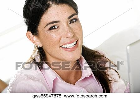 Stock Photography - Portrait of a businesswoman smiling. Fotosearch