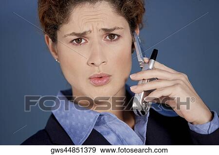Portrait of a businesswoman talking on a mobile phone View Large Photo Image Stock Photo - Portrait of a businesswoman talking on a mobile phone. Fotosearch