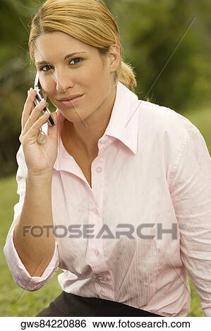 Portrait of a businesswoman talking on a mobile phone View Large Photo Image Stock Photograph - Portrait of a businesswoman talking on a mobile phone. Fotosearch