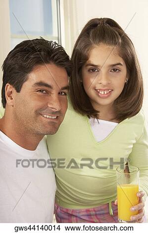 Portrait of a father and his daughter smiling View Large Photo Image Picture - Portrait of a father and his daughter smiling. Fotosearch