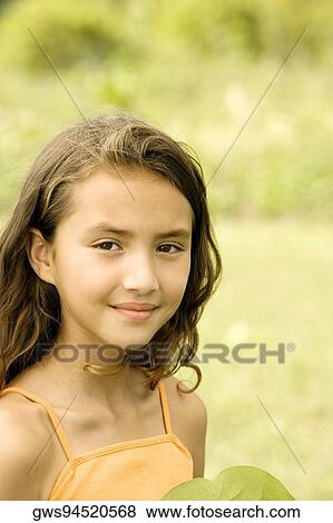 Stock Photo - Portrait of a girl smiling. Fotosearch