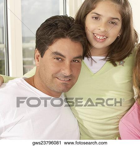 Portrait of a girl smiling with her father View Large Photo Image Stock Image - Portrait of a girl smiling with her father. Fotosearch