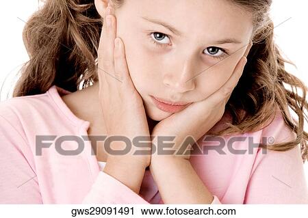 Portrait of a girl with her hands on her chin View Large Photo Image Stock Image - Portrait of a girl with her hands on her chin. Fotosearch