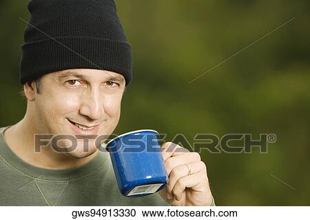 Portrait of a mature man holding a mug View Large Photo Image Stock Image - Portrait of a mature man holding a mug. Fotosearch