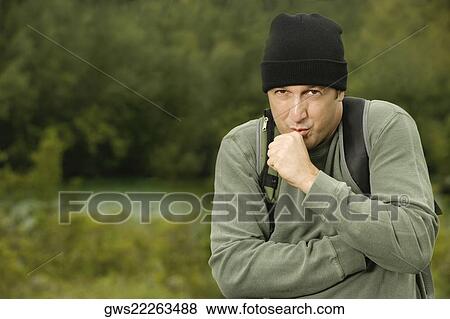 Stock Photo - Portrait of a mature man shivering. Fotosearch