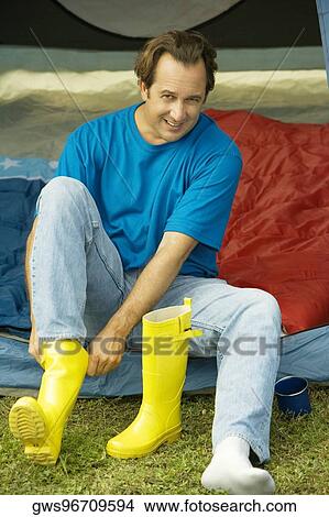 Portrait of a mature man wearing galoshes View Large Photo Image Picture - Portrait of a mature man wearing galoshes. Fotosearch