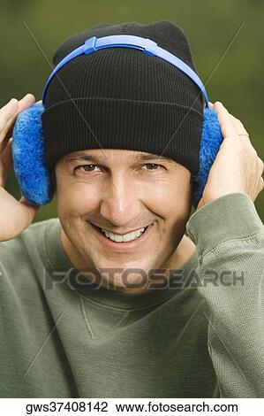 Portrait of a mature man wearing headphones View Large Photo Image Stock Image - Portrait of a mature man wearing headphones. Fotosearch