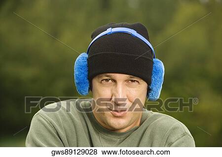 Portrait of a mature man wearing headphones View Large Photo Image Stock Photo - Portrait of a mature man wearing headphones. Fotosearch