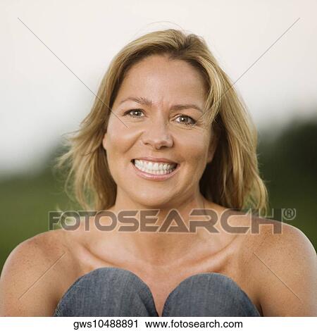 Portrait of a mature woman smiling View Large Photo Image Stock Image - Portrait of a mature woman smiling. Fotosearch