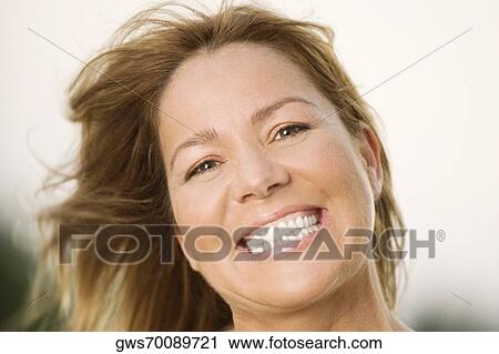 Portrait of a mature woman smiling View Large Photo Image Stock Image - Portrait of a mature woman smiling. Fotosearch
