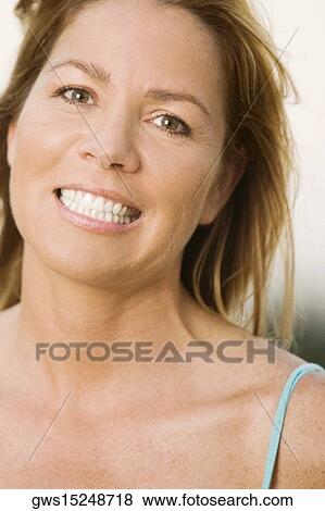 Portrait of a mature woman smiling View Large Photo Image Stock Photo - Portrait of a mature woman smiling. Fotosearch