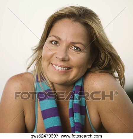 Portrait of a mature woman smiling View Large Photo Image Stock Photo - Portrait of a mature woman smiling. Fotosearch