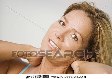 Portrait of a mature woman smiling View Large Photo Image Stock Photo - Portrait of a mature woman smiling. Fotosearch