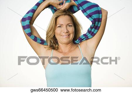 Portrait of a mature woman with her hands raised View Large Photo Image Stock Image - Portrait of a mature woman with her hands raised. Fotosearch