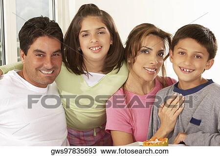 Portrait of a mid adult couple with their children View Large Photo Image Stock Image - Portrait of a mid adult couple with their children. Fotosearch