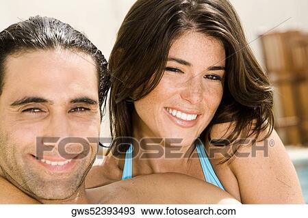 Portrait of a mid adult man and a young woman smiling View Large Photo Image Stock Image - Portrait of a mid adult man and a young woman smiling. Fotosearch