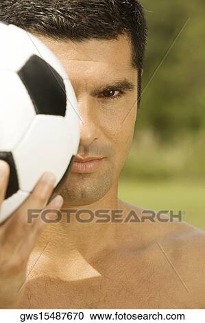 Portrait of a mid adult man holding a soccer ball View Large Photo Image Stock Image - Portrait of a mid adult man holding a soccer ball. Fotosearch