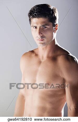 Stock Image - Portrait of a mid adult man looking serious. Fotosearch