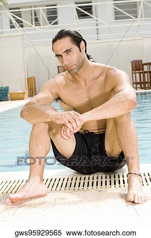 Portrait of a mid adult man sitting at the poolside View Large Photo Image Stock Photography - Portrait of a mid adult man sitting at the poolside. Fotosearch