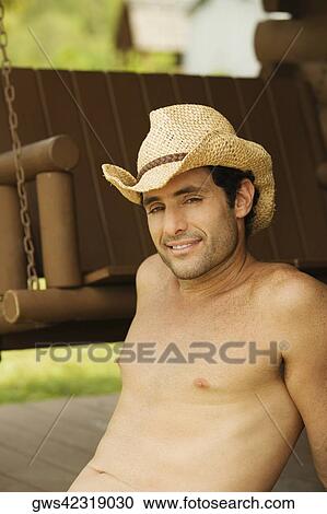 Portrait of a mid adult man wearing a hat View Large Photo Image Stock Image - Portrait of a mid adult man wearing a hat. Fotosearch