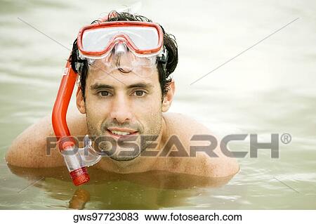 Portrait of a mid adult man wearing a scuba mask View Large Photo Image Stock Image - Portrait of a mid adult man wearing a scuba mask. Fotosearch