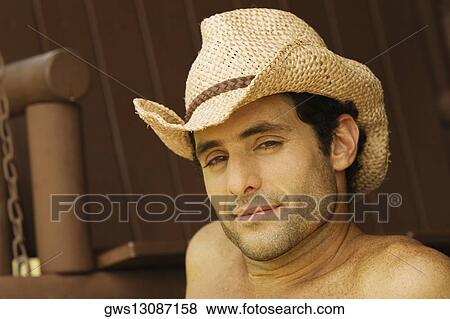 Portrait of a mid adult man wearing a hat View Large Photo Image Stock Photo - Portrait of a mid adult man wearing a hat. Fotosearch