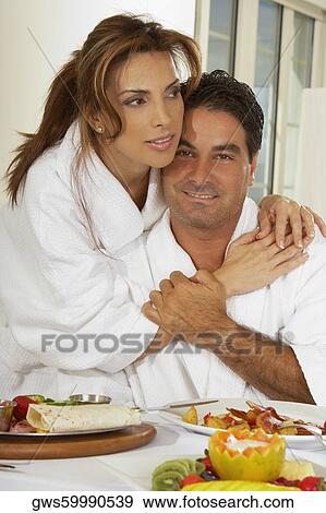 Portrait of a mid adult woman embracing a mid adult man View Large Photo Image Stock Photo - Portrait of a mid adult woman embracing a mid adult man. Fotosearch