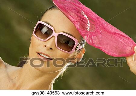 Portrait of a mid adult woman holding a butterfly net View Large Photo Image Stock Image - Portrait of a mid adult woman holding a butterfly net. Fotosearch