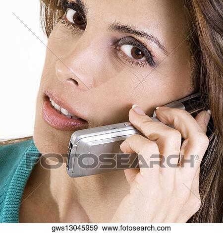 Portrait of a mid adult woman talking on a mobile phone View Large Photo Image Stock Photo - Portrait of a mid adult woman talking on a mobile phone. Fotosearch