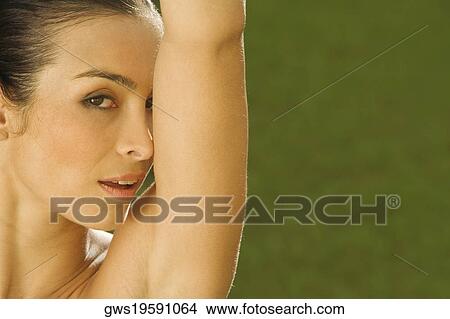Portrait of a mid adult woman with her hand raised View Large Photo Image Picture - Portrait of a mid adult woman with her hand raised. Fotosearch