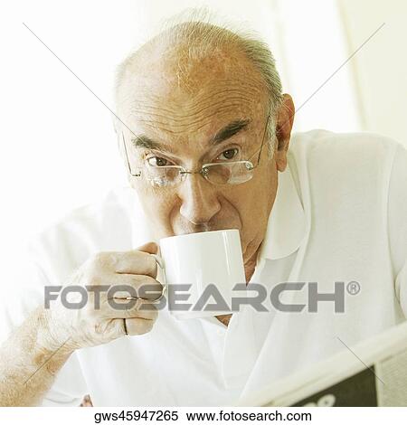 Portrait of a senior man drinking coffee View Large Photo Image Stock Photography - Portrait of a senior man drinking coffee. Fotosearch