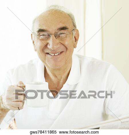Portrait of a senior man holding a coffee cup View Large Photo Image Stock Photography - Portrait of a senior man holding a coffee cup. Fotosearch