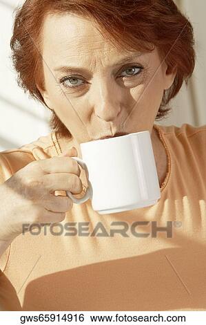 Portrait of a senior woman drinking coffee View Large Photo Image Stock Photograph - Portrait of a senior woman drinking coffee. Fotosearch