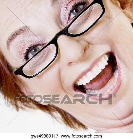 Portrait of a senior woman smiling View Large Photo Image Stock Photo - Portrait of a senior woman smiling. Fotosearch