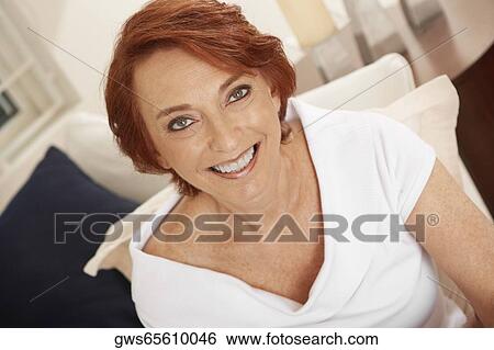 Portrait of a senior woman smiling View Large Photo Image Stock Photograph - Portrait of a senior woman smiling. Fotosearch