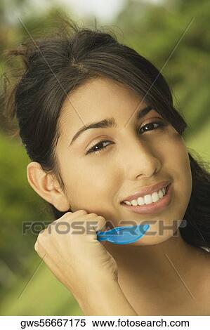 Portrait of a teenage girl holding a table knife View Large Photo Image Stock Photography - Portrait of a teenage girl holding a table knife. Fotosearch