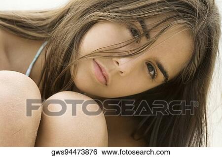 Stock Photograph - Portrait of a teenage girl looking serious. Fotosearch