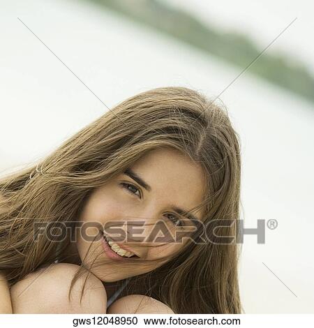 Portrait of a teenage girl smiling View Large Photo Image Stock Image - Portrait of a teenage girl smiling. Fotosearch