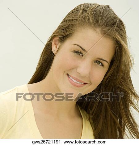 Portrait of a teenage girl smiling View Large Photo Image Stock Image - Portrait of a teenage girl smiling. Fotosearch