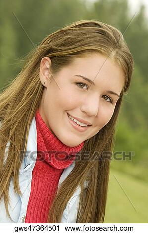 Stock Image - Portrait of a teenage girl smiling. Fotosearch