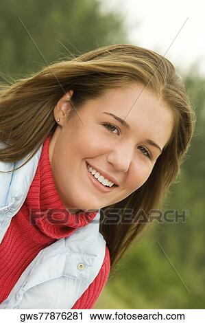 Portrait of a teenage girl smiling View Large Photo Image Stock Image - Portrait of a teenage girl smiling. Fotosearch