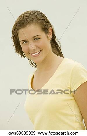 Portrait of a teenage girl smiling View Large Photo Image Stock Photo - Portrait of a teenage girl smiling. Fotosearch
