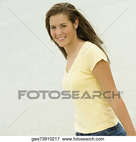 Stock Photo - Portrait of a teenage girl smiling. Fotosearch