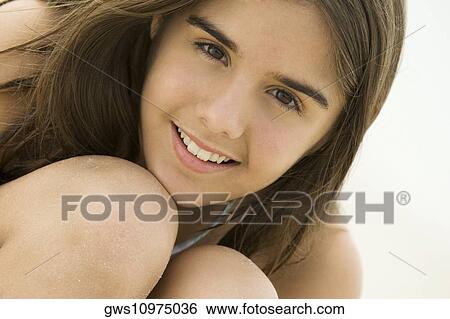 Stock Photograph - Portrait of a teenage girl smiling. Fotosearch