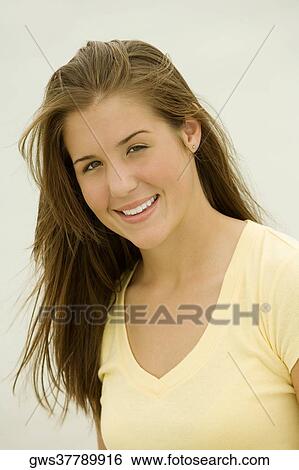 Stock Photograph - Portrait of a teenage girl smiling. Fotosearch
