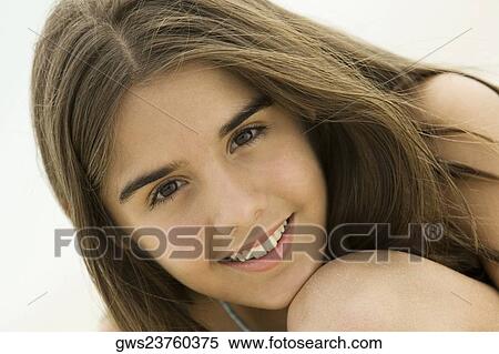 Stock Photography - Portrait of a teenage girl smiling. Fotosearch
