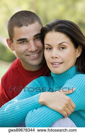 Picture - Portrait of a young couple smiling. Fotosearch