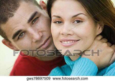 Portrait of a young couple smiling View Large Photo Image Stock Photo - Portrait of a young couple smiling. Fotosearch