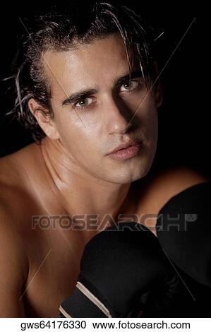 Portrait of a young man in a fighting stance View Large Photo Image Stock Image - Portrait of a young man in a fighting stance. Fotosearch